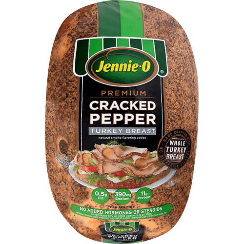 JENNIE-O® Premium Cracked Pepper Turkey Breast in branded packaging with a picture of an open faced turkey sandwich topped with herbs and resting on tomatoes on sliced bread.