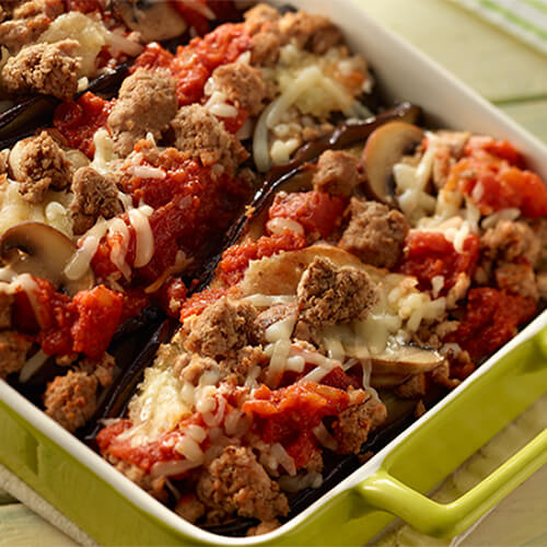Eggplants stuffed with marinara sauce, mozzerella cheese, ground turkey and mushrooms, served in a casserole tray.