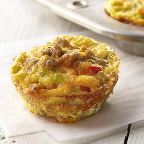 Turkey breakfast quiche on a white background.