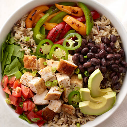 Turkey burrito bowl with jalapeno in a white bowl.