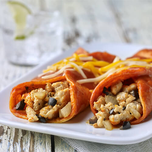 2 turkey enchiladas covered in a tangy enchilada sauce and cheese, and filled with ripe olives and ground turkey.