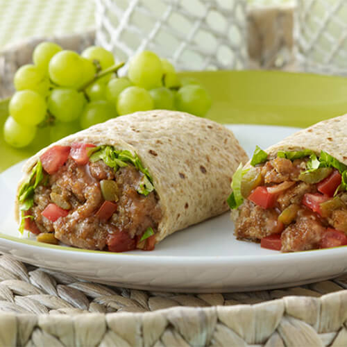 2 tasty rollup halves filled with lean turkey, fresh vegetables, salsa and sour cream wrapped up in tortillas.