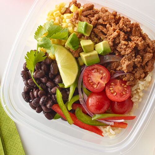 Turkey tex mex meal bowls on a white plate on a white table.