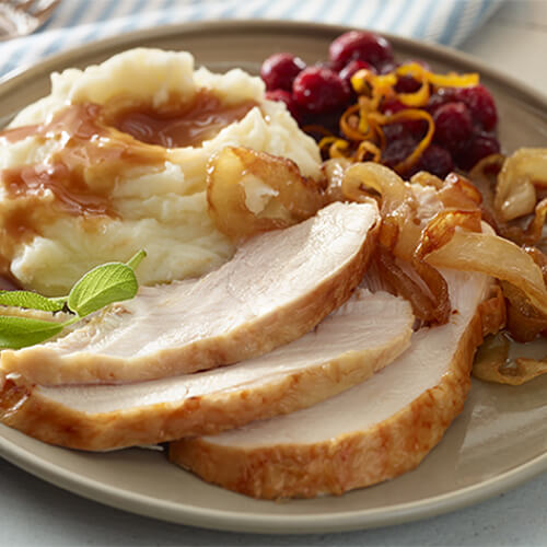 Tender slices of turkey served with sweet onions, cranberries, and mashed potatoes, topped with a cranberry gravy.